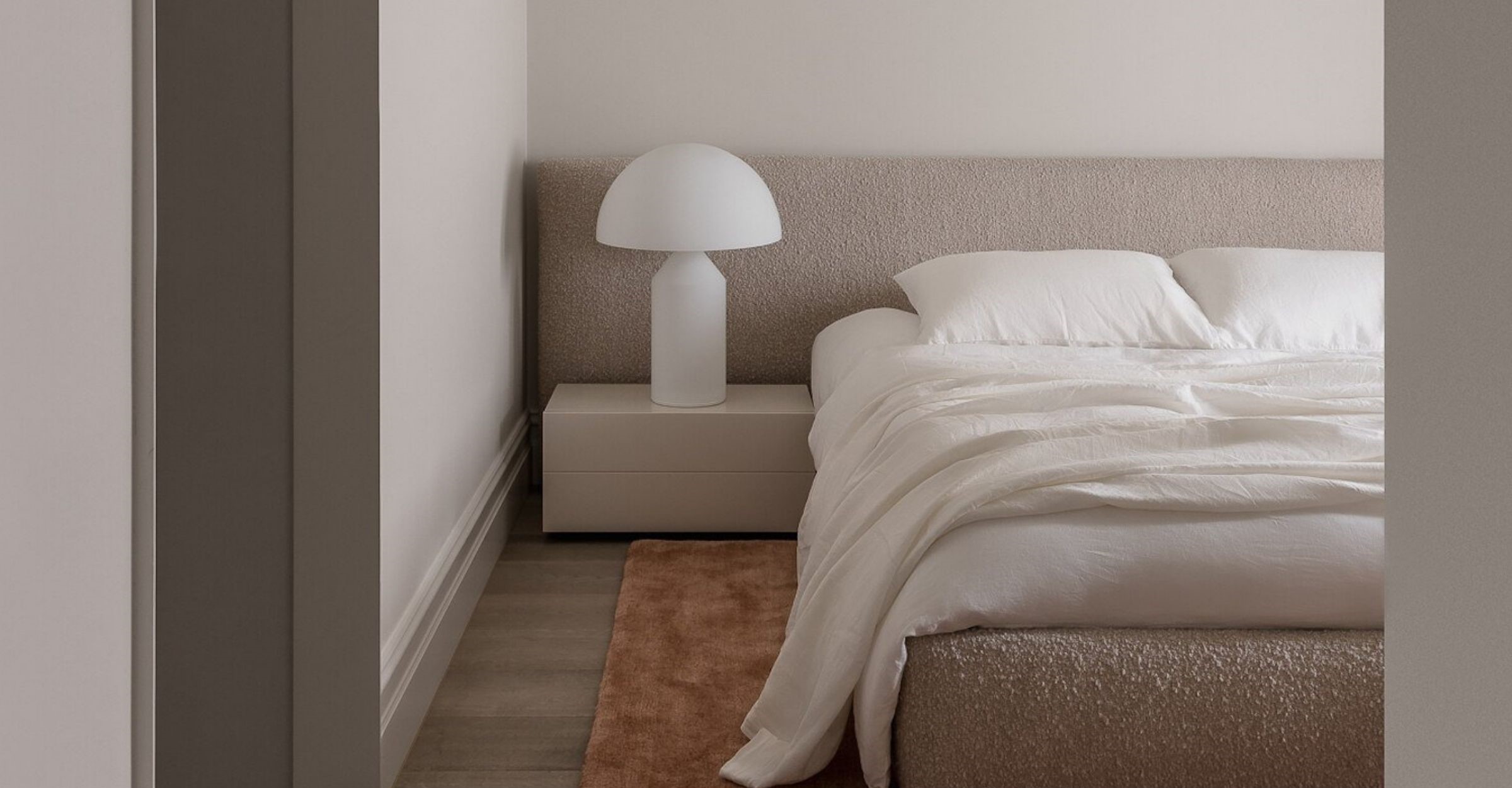 cosy neutral bedroom design with white statement lamp